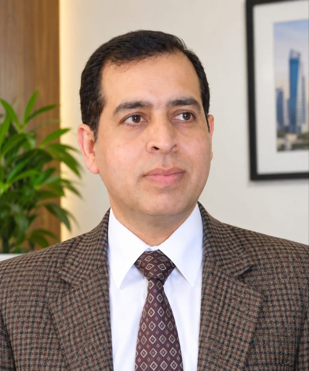 Portrait of Syed Mujahid Ali - Founder & CEO
